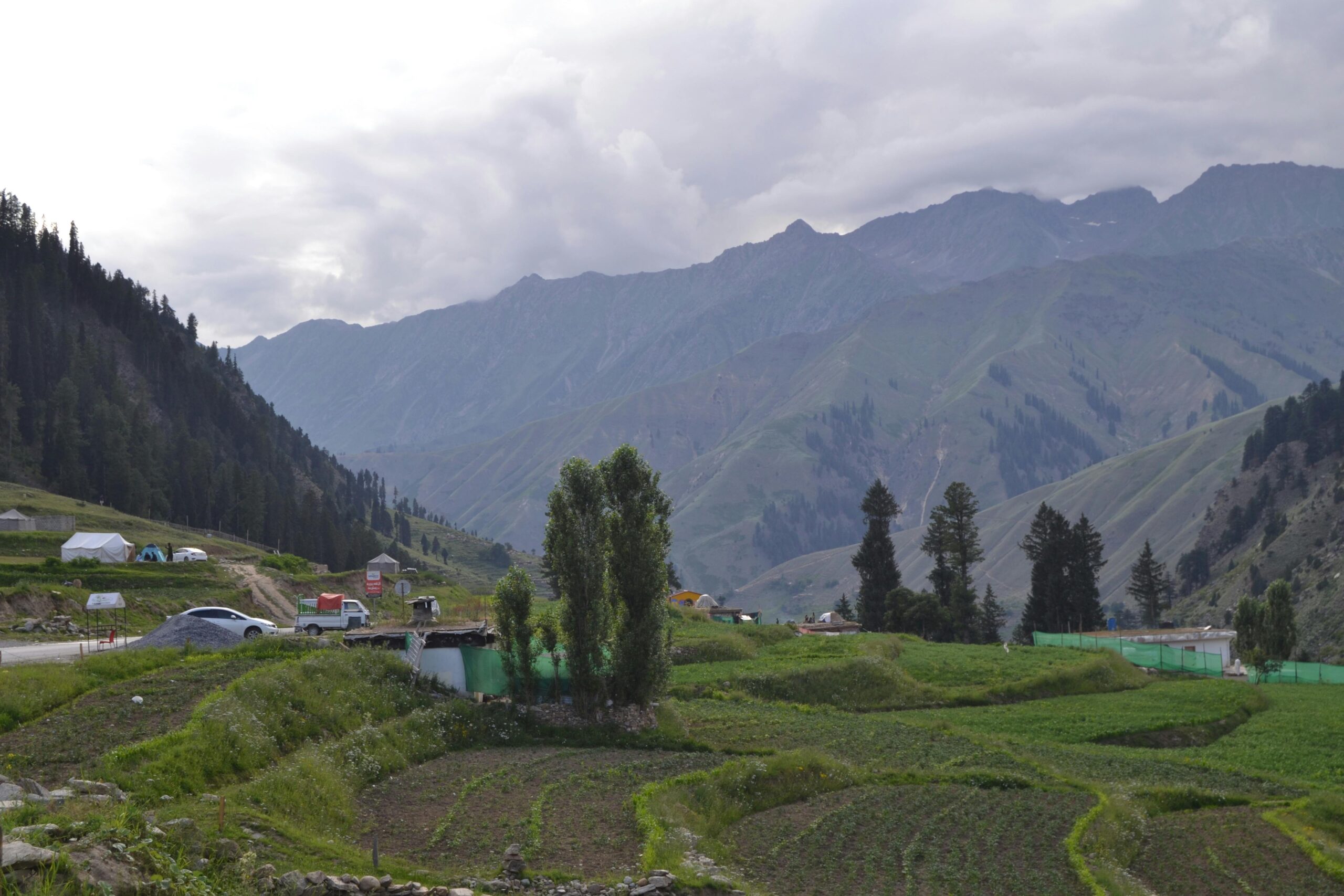 Majestic view of Batakundi's lush fields and mountains in Pakistan.