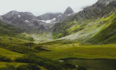 Explore the lush green valleys and majestic peaks of Trentino-Alto Adige in this breathtaking landscape.