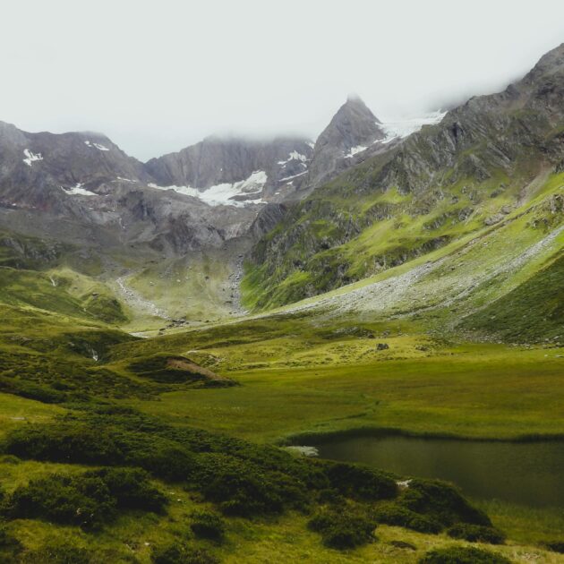 Explore the lush green valleys and majestic peaks of Trentino-Alto Adige in this breathtaking landscape.