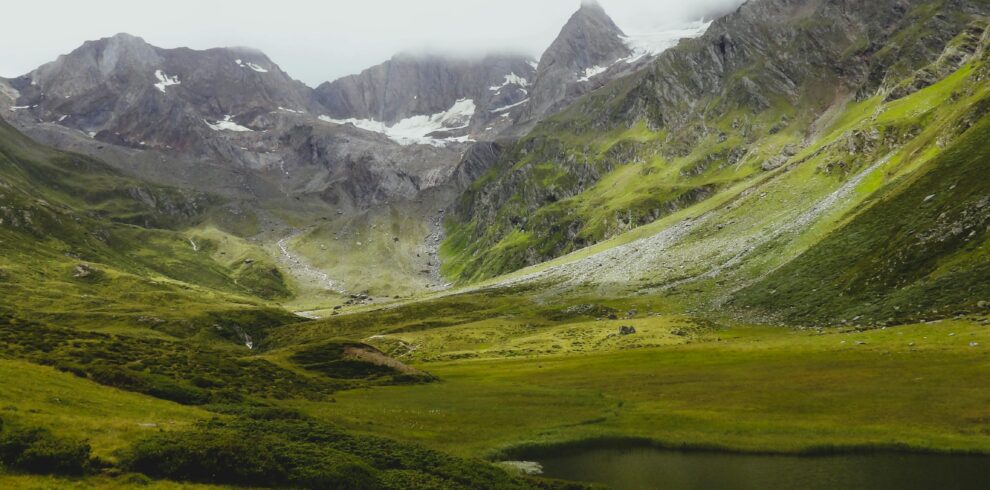 Explore the lush green valleys and majestic peaks of Trentino-Alto Adige in this breathtaking landscape.