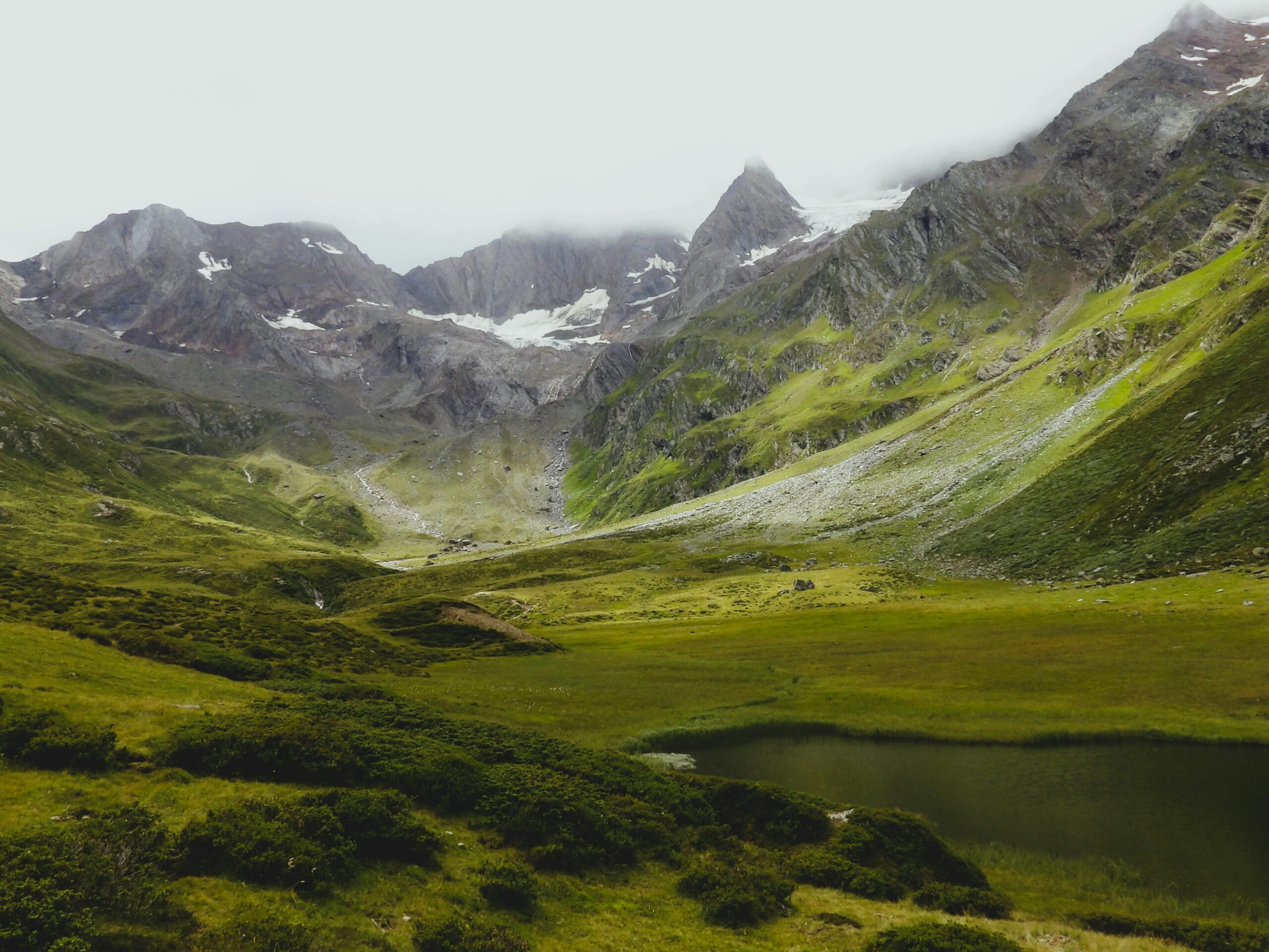 Explore the lush green valleys and majestic peaks of Trentino-Alto Adige in this breathtaking landscape.